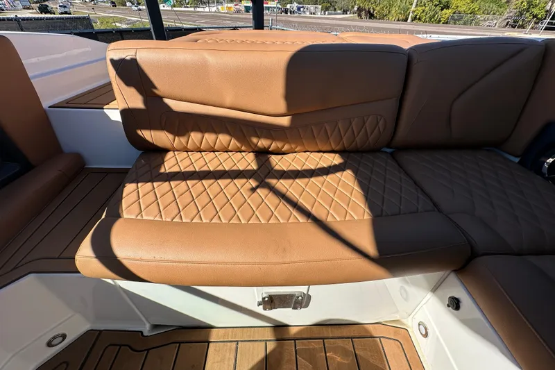 Slide: The Image of Luxurious brown leather seating on 2016 Monterey 218 Surf boat, featuring diamond stitching. - 66