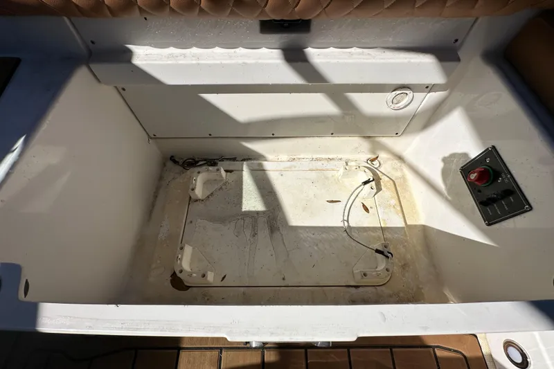 Slide: The Image of 2016 Monterey 218 Surf boat storage compartment with control panel and wiring. - 68