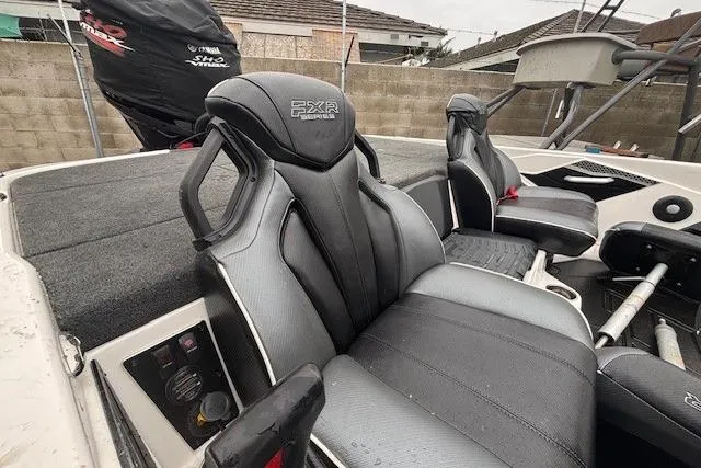 Slide: The Image of 2024 Skeeter FXR21 Limited boat seats, featuring sleek black design and comfortable cushioning. - 10