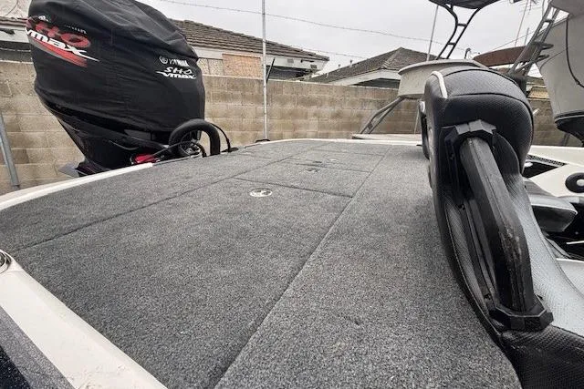 Slide: The Image of 2024 Skeeter FXR21 Limited boat deck with Yamaha VMAX engine cover, parked outdoors. - 11