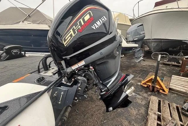 Slide: The Image of 2024 Skeeter FXR21 Limited with Yamaha SHO VMAX engine, docked among other boats. - 19
