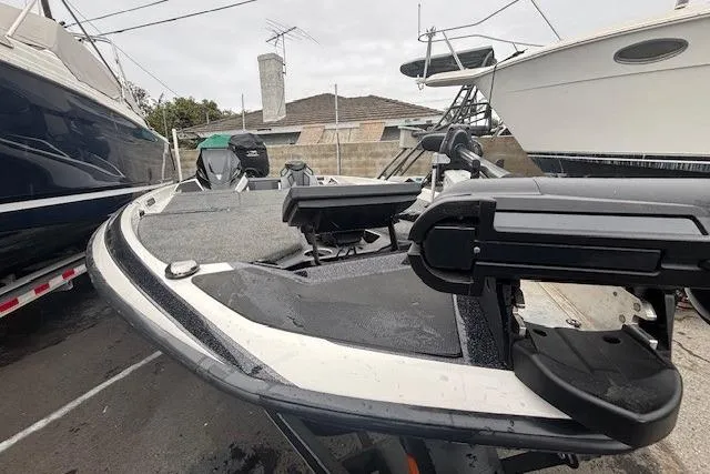 Slide: The Image of 2024 Skeeter FXR21 Limited boat in storage, showcasing sleek design and advanced features. - 2