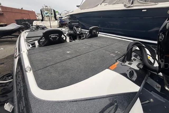 Slide: The Image of 2024 Skeeter FXR21 Limited fishing boat with spacious deck and dual seating. - 20