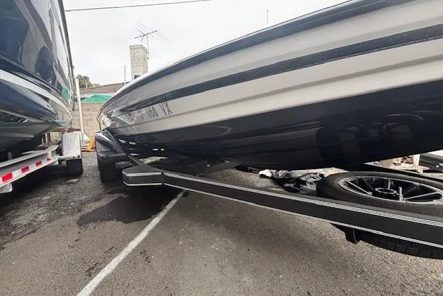 Slide: The Image of 2024 Skeeter FXR21 Limited boat on trailer, parked outdoors. - 3