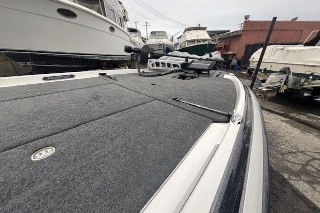 Slide: The Image of 2024 Skeeter FXR21 Limited boat deck in marina, showcasing sleek design and advanced features. - 5