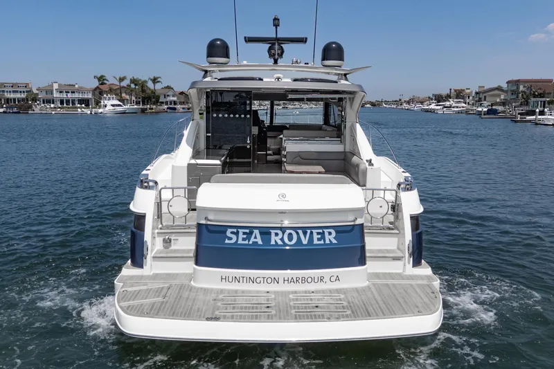 Slide: The Image of Riviera 4800 Sport Yacht 2021, "Sea Rover," in Huntington Harbour, CA, rear view. - 18
