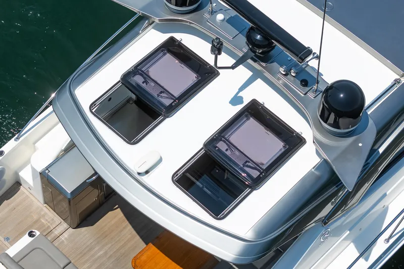 Slide: The Image of 2021 Riviera 4800 Sport Yacht, aerial view of sleek deck design and modern features. - 26