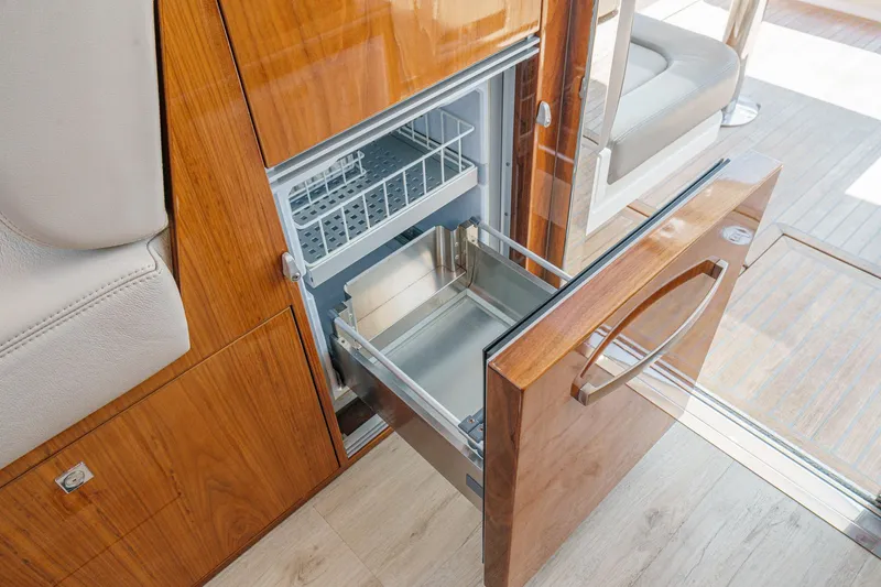 Slide: The Image of Open drawer refrigerator in 2021 Riviera 4800 Sport Yacht interior. - 39