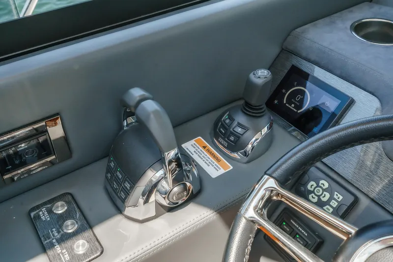 Slide: The Image of Control panel of 2021 Riviera 4800 Sport Yacht with joystick and touchscreen display. - 47