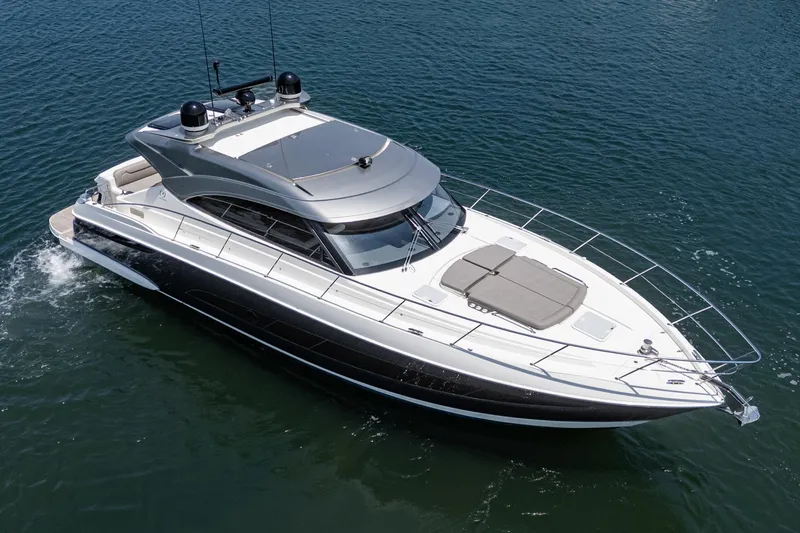Slide: The Image of 2021 Riviera 4800 Sport Yacht cruising on open water. - 6