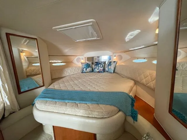 Slide: The Image of Interior of 2002 Sea Ray 340 Sundancer with cozy bed. - 18
