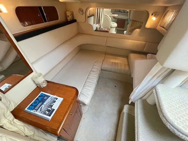 Slide: The Image of Interior of a 2002 Sea Ray 340 Sundancer yacht, cozy seating area. - 19