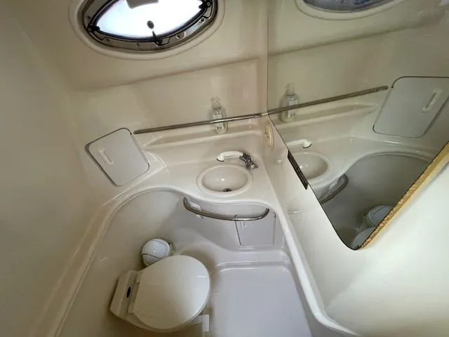 Slide: The Image of Sea Ray 340 Sundancer 2002 bathroom with toilet and sink. - 20