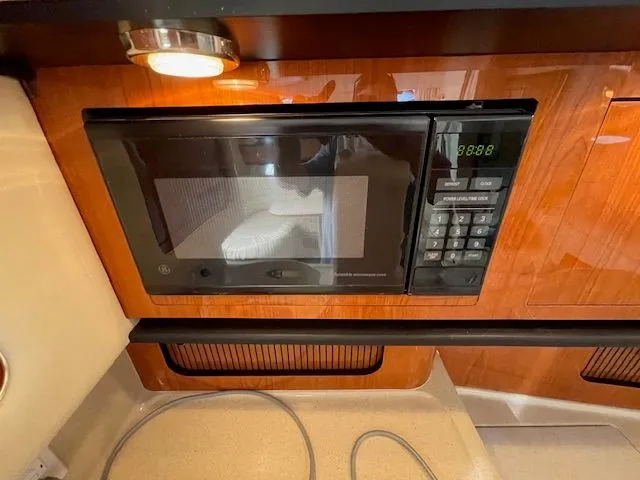 Slide: The Image of Microwave in 2002 Sea Ray 340 Sundancer yacht kitchen. - 22