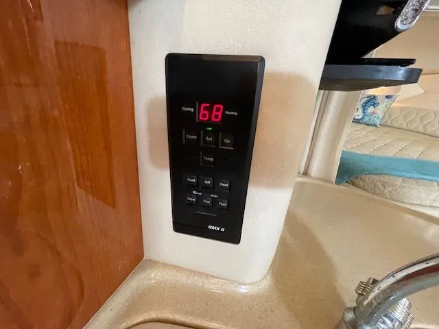 Slide: The Image of Control panel in a 2002 Sea Ray 340 Sundancer yacht. - 23