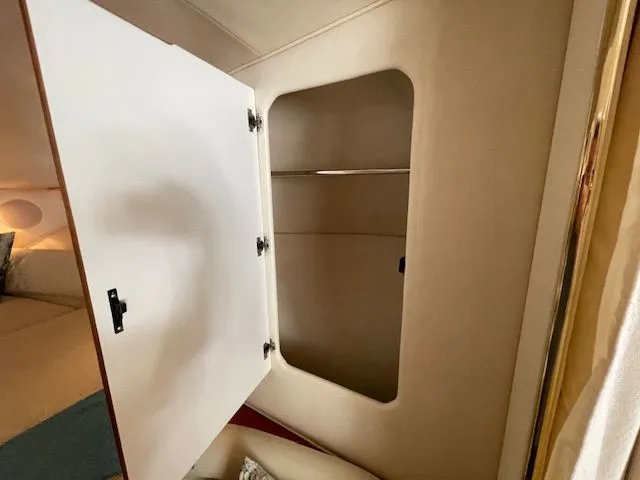 Slide: The Image of Open closet in Sea Ray 340 Sundancer 2002 boat. - 25