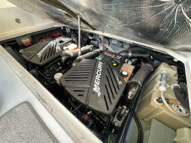 Slide: The Image of Engine compartment of a 2002 Sea Ray 340 Sundancer with Mercury engines. - 28