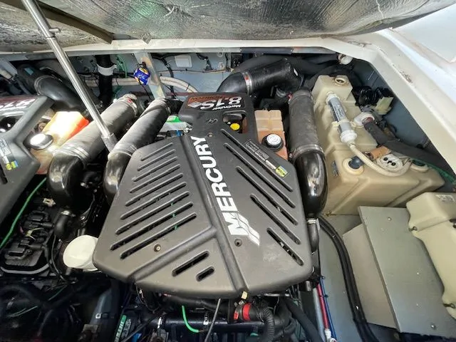 Slide: The Image of Engine compartment of a 2002 Sea Ray 340 Sundancer boat with Mercury engine. - 29