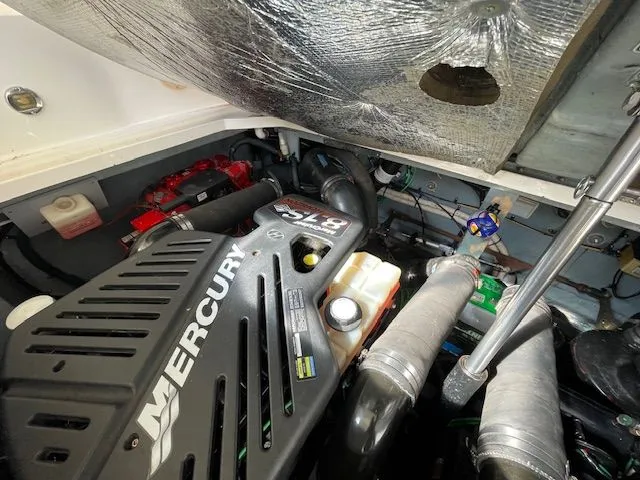 Slide: The Image of Engine compartment of a 2002 Sea Ray 340 Sundancer with Mercury engine. - 32