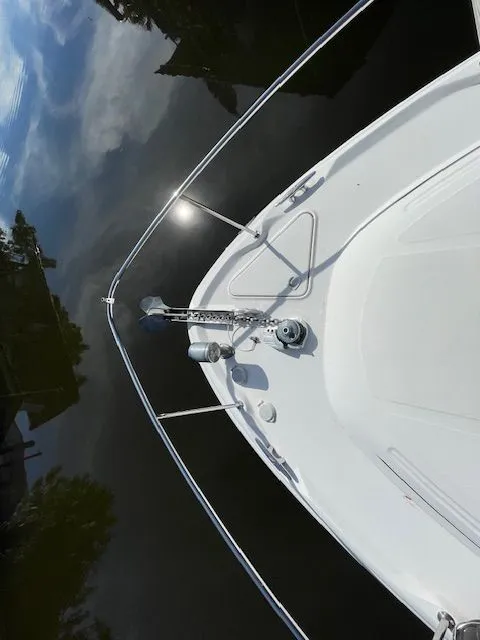 Slide: The Image of Bow view of a 2002 Sea Ray 340 Sundancer on calm water. - 35