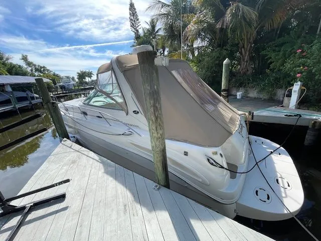 Slide: The Image of 2002 Sea Ray 340 Sundancer docked on a sunny day. - 40