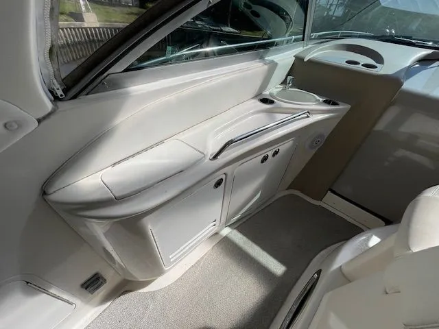 Slide: The Image of Interior of 2002 Sea Ray 340 Sundancer, white upholstery and storage area. - 5