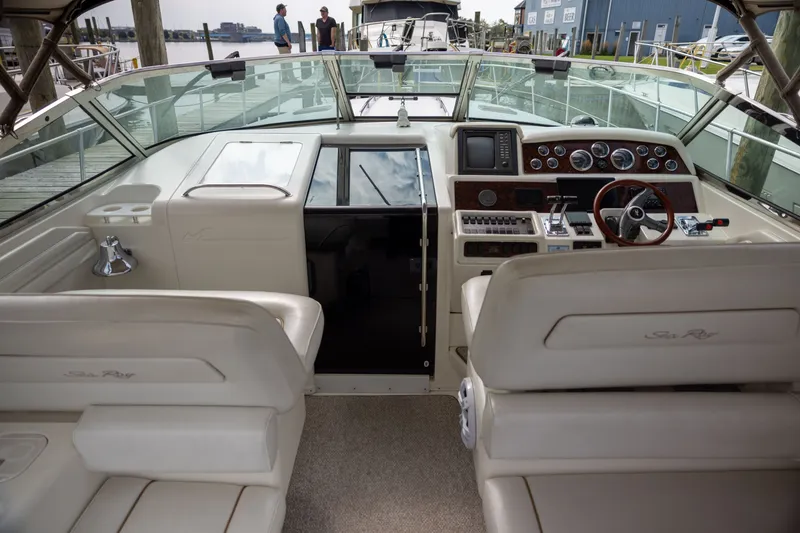 Slide: The Image of Interior of a 1997 Sea Ray 400 yacht with helm console. - 14