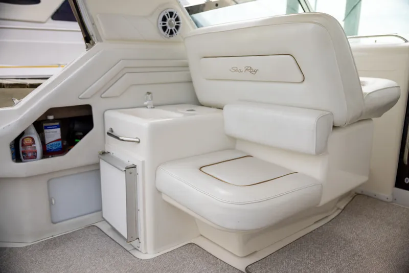 Slide: The Image of Interior of a 1997 Sea Ray 400 boat with white seating. - 15