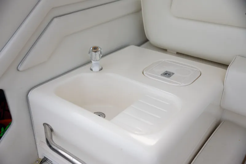 Slide: The Image of Interior of 1997 Sea Ray 400 yacht featuring a sink. - 16