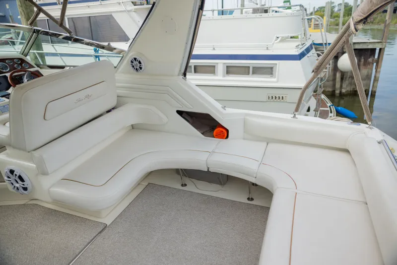 Slide: The Image of Interior of a 1997 Sea Ray 400 yacht with white seating area. - 18