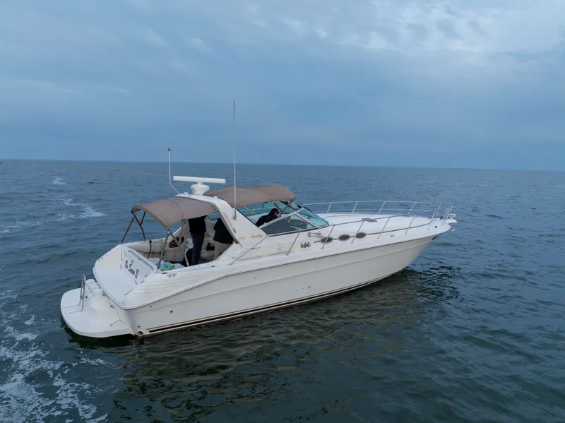 Slide: The Image of 1997 Sea Ray 400 yacht on open sea. - 2