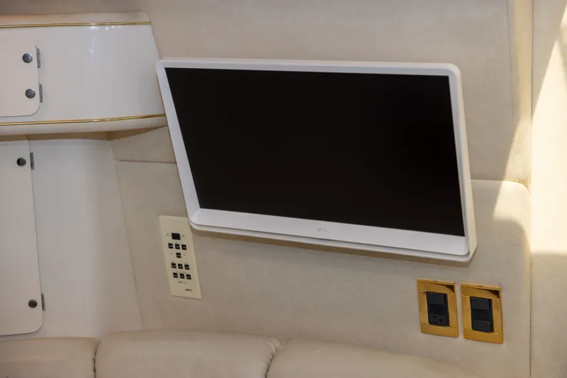 Slide: The Image of Interior of a 1997 Sea Ray 400 yacht with a TV. - 21