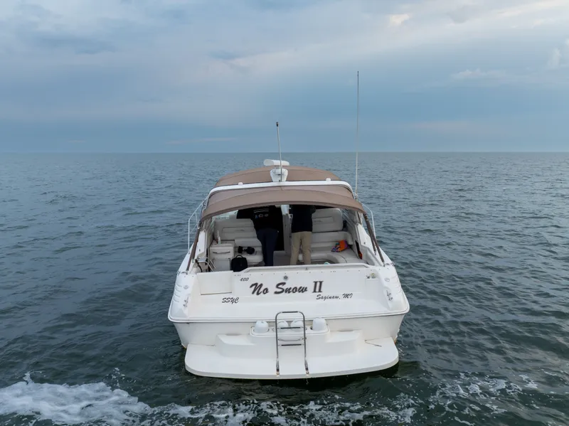 Slide: The Image of 1997 Sea Ray 400 boat on open sea. - 3