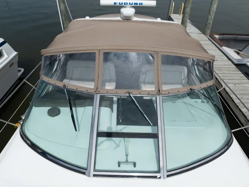 Slide: The Image of 1997 Sea Ray 400 boat with canopy at dock. - 7