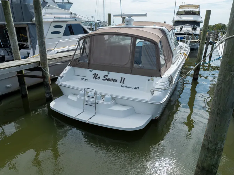 Slide: The Image of 1997 Sea Ray 400 boat docked in marina. - 9