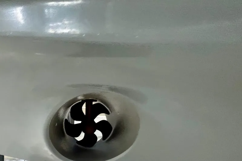 Slide: The Image of 2024 Axopar 37 XC Cross Cabin boat in indoor storage facility. - 13