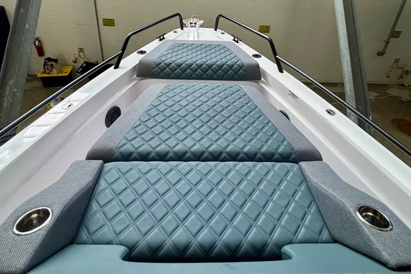 Slide: The Image of 2024 Axopar 37 XC Cross Cabin boat interior with cushioned seating and sleek design. - 18