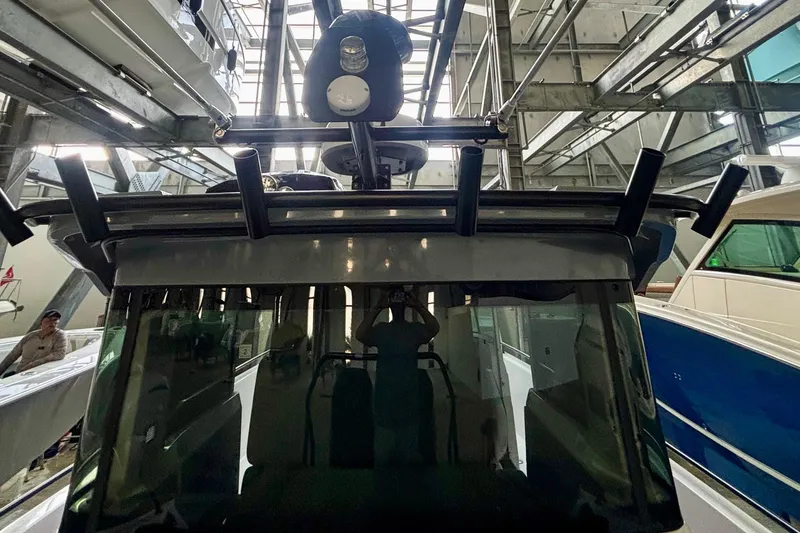 Slide: The Image of 2024 Axopar 37 XC Cross Cabin with dual Mercury outboard engines. - 35