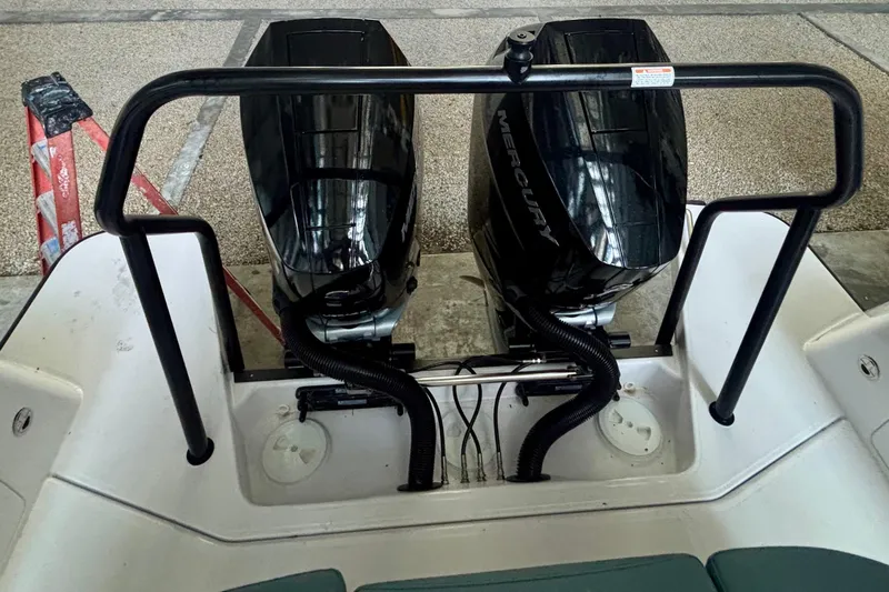 Slide: The Image of 2024 Axopar 37 XC Cross Cabin in a storage facility, showcasing sleek design and powerful engines. - 36