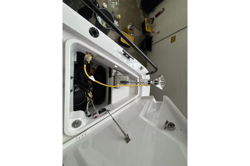 Slide: The Image of 2024 Axopar 37 XC Cross Cabin boat control panel with warning label and equipment. - 40