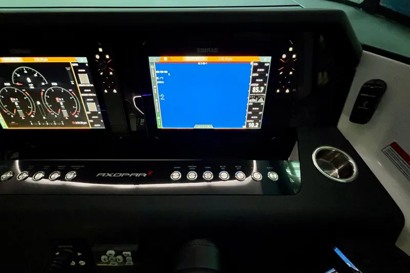 Slide: The Image of Control panel of 2024 Axopar 37 XC Cross Cabin with joystick and navigation controls. - 44
