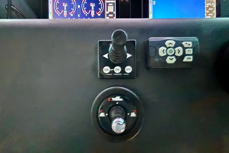 Slide: The Image of Steering wheel of 2024 Axopar 37 XC Cross Cabin boat, featuring sleek design and controls. - 45