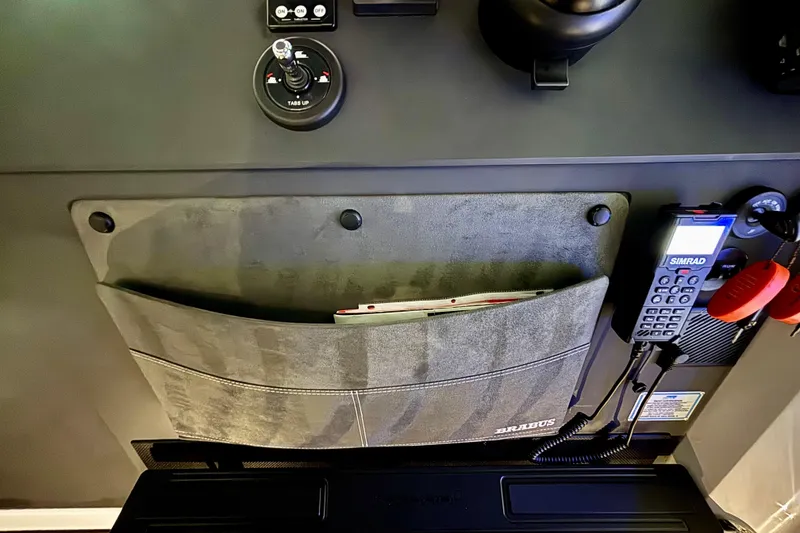 Slide: The Image of 2024 Axopar 37 XC Cross Cabin interior with luxurious quilted seating. - 49