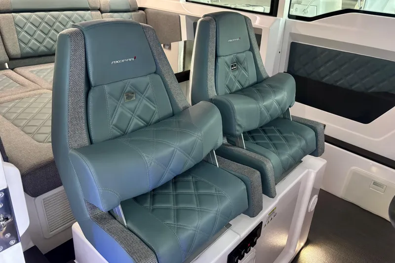 Slide: The Image of 2024 Axopar 37 XC Cross Cabin interior with luxurious quilted seats. - 50