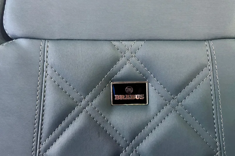 Slide: The Image of Interior of 2024 Axopar 37 XC Cross Cabin with plush seating and panoramic windows. - 52