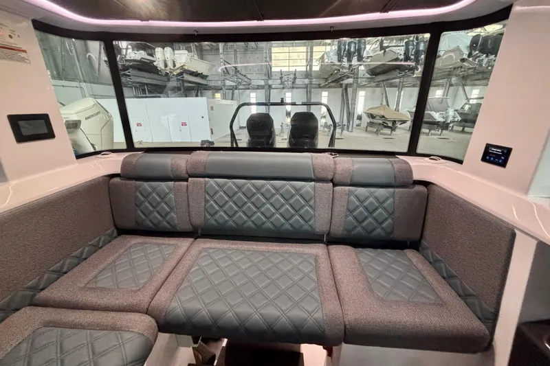 Slide: The Image of 2024 Axopar 37 XC Cross Cabin interior with stylish seating and modern design. - 55