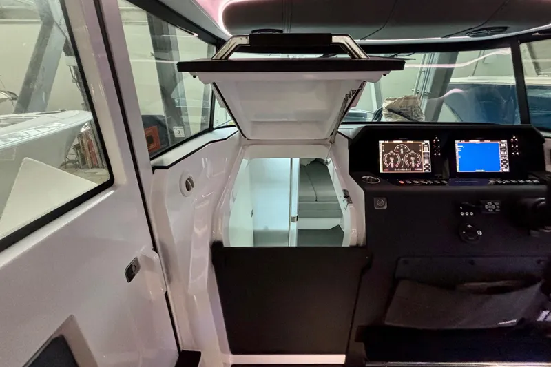 Slide: The Image of 2024 Axopar 37 XC Cross Cabin bathroom with shower and toilet. - 59