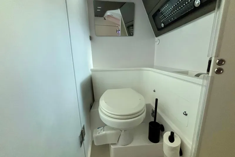 Slide: The Image of 2024 Axopar 37 XC Cross Cabin bathroom sink with modern faucet design. - 61