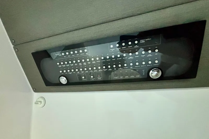 Slide: The Image of 2024 Axopar 37 XC Cross Cabin interior with cozy seating and modern design. - 63