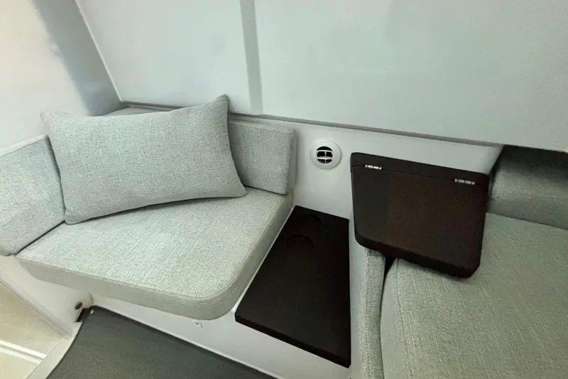 Slide: The Image of 2024 Axopar 37 XC Cross Cabin interior with modern seating and sleek design. - 67